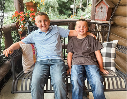 Carissa Bryant’s sons on a porch swing