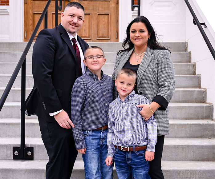 Carissa Bryant and her family in front of steps
